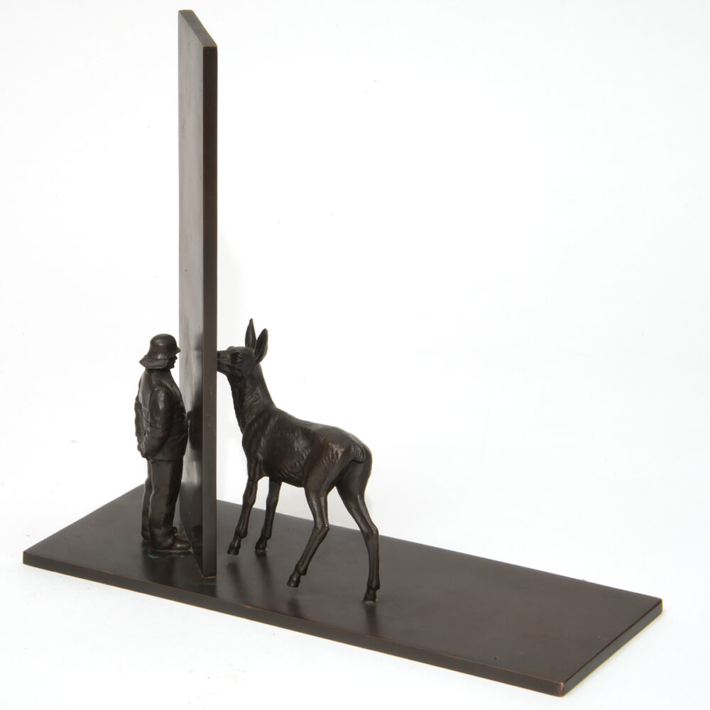 Untitled (man and deer at wall)